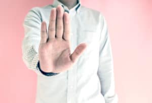 Man holding up his hand to stop